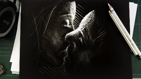 kiss sketch on black paper