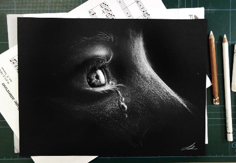 eye sketch portrait on black paper