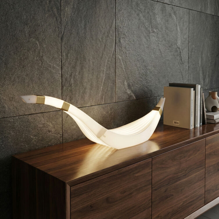 Side profile of the Cygnus modern lamp showing fluid swan-like lines.