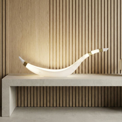 Side profile of the Cygnus modern lamp showing fluid swan-like lines.