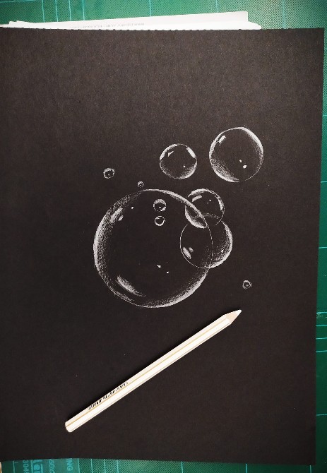 black papaer sketch with white pencil soap bubble 