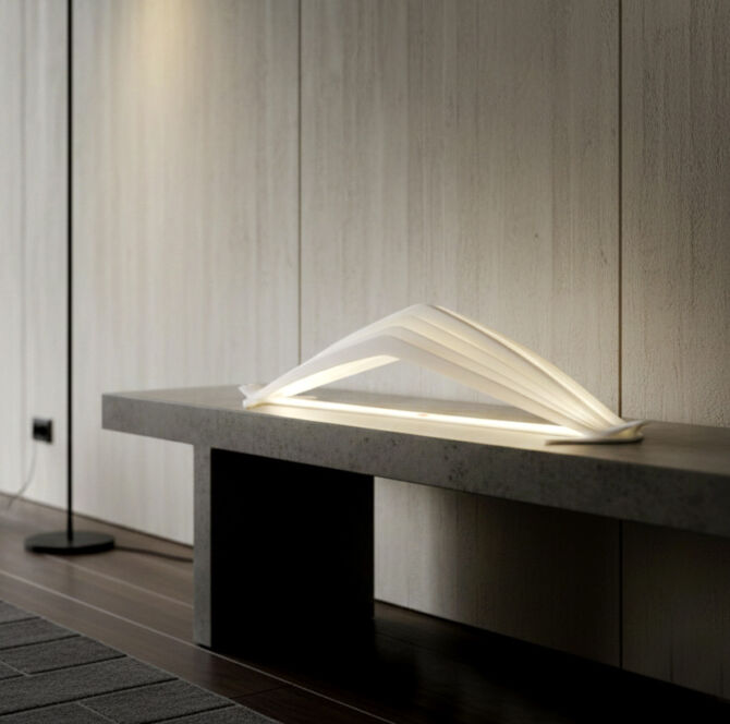 Illuminated Manta lamp displaying the contrast between the light source and the circular metal frame.