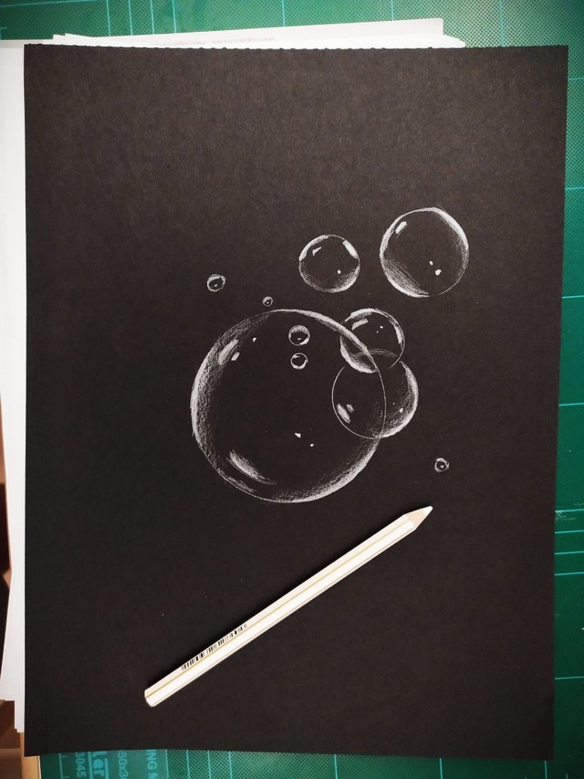 Soap bubbles sketch on black paper.jpg