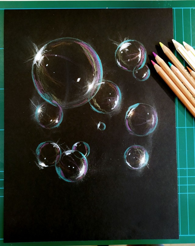 coloured sketch of a soap bubble on black paper.jpg
